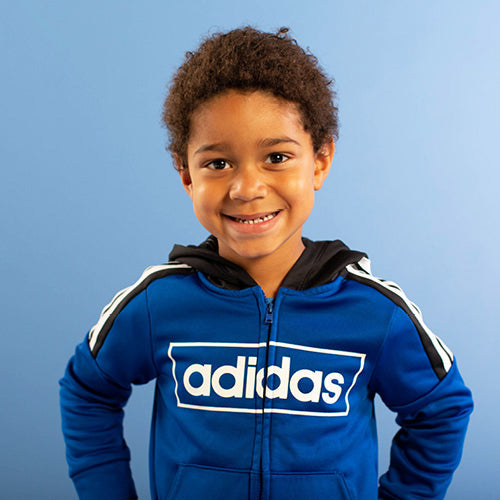 Toddler boy in adidas jacfket
